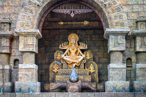 Idol of Goddess Devi Durga at a decorated puja pandal in Kolkata, West Bengal, India. Durga Puja is a famous and major religious festival of Hinduism that is celebrated throughout the world. photo