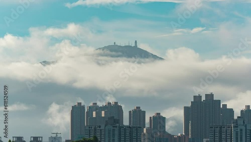 Time lapse of sea of clouds with natural landmark mountain Tai Mo Shan in Hong Kong
