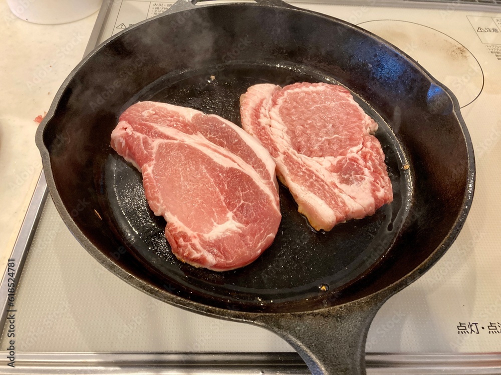 Pork on a skillet. Pork on a skillet.