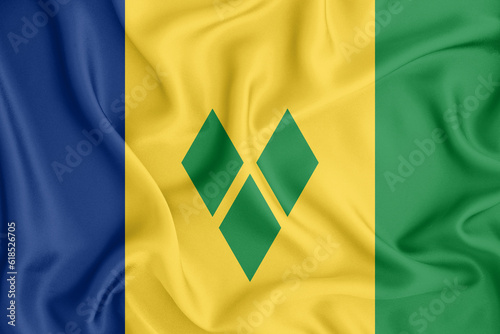 Saint Vincent and the Grenadines flag waving with the wind, wide format, 3D illustration rendring. Design with satin fabric. to be used for educational purposes or for illustrations of videos or vlogs