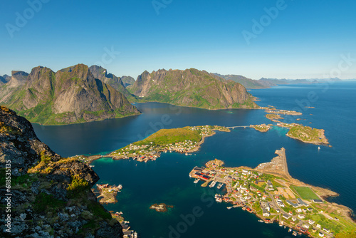 View of village Reine from Reinebringen with dramatic mountains and peaks, open sea and bays, Lofoten islands, Nordland, Norway. The most popular view of Lofoten islands.