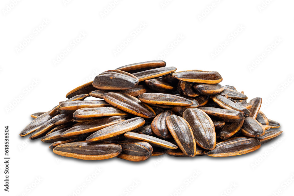 Side view pile of salted sunflowers seeds isolated on white background with clipping path. Side view pile of salted sunflowers seeds isolated on white background with clipping path.