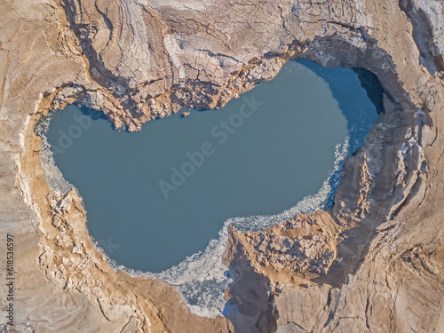 A sink hole filled with water in the dead sea 