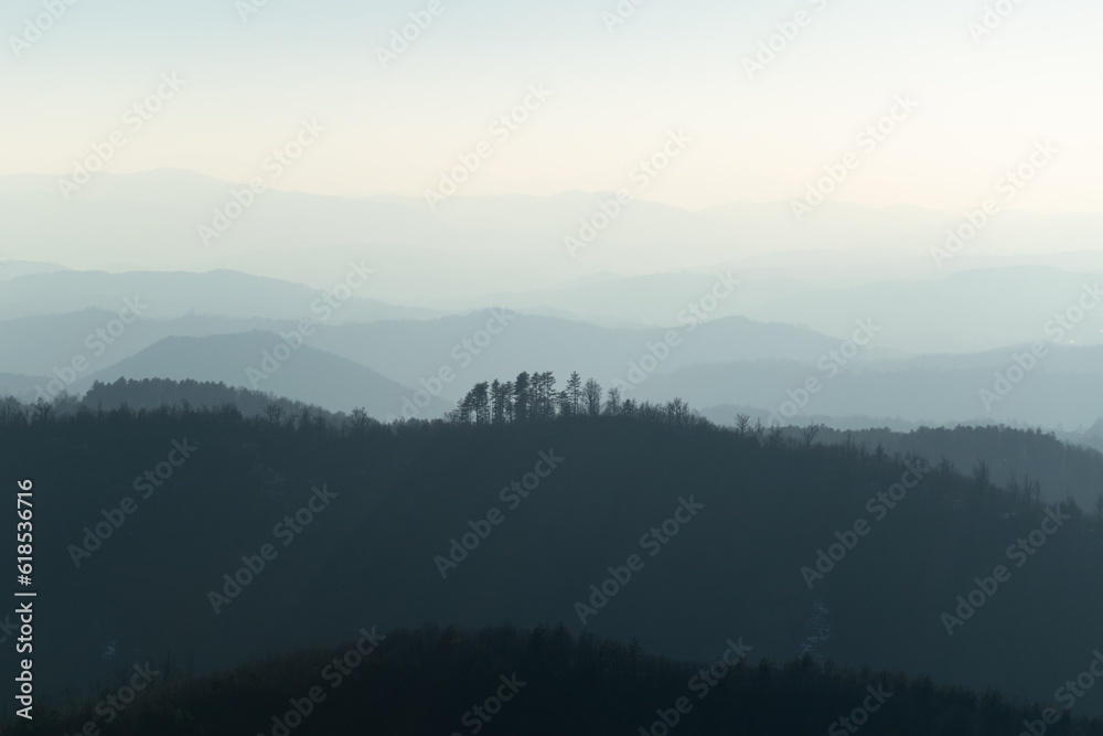 Naklejka premium Mountain landscape with mountain layers fading in distance, view from mountain Ljubic near Prnjavor