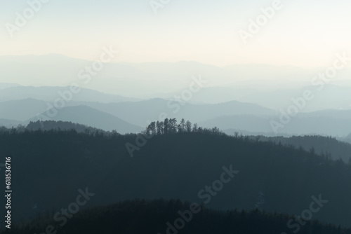 Mountain landscape with mountain layers fading in distance, view from mountain Ljubic near Prnjavor photo