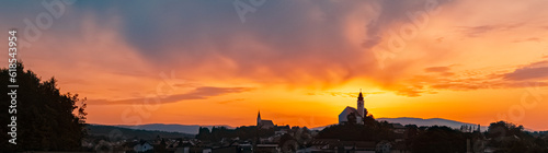 Sunrise with two church silhouettes near Hengersberg, Bavaria, Germany