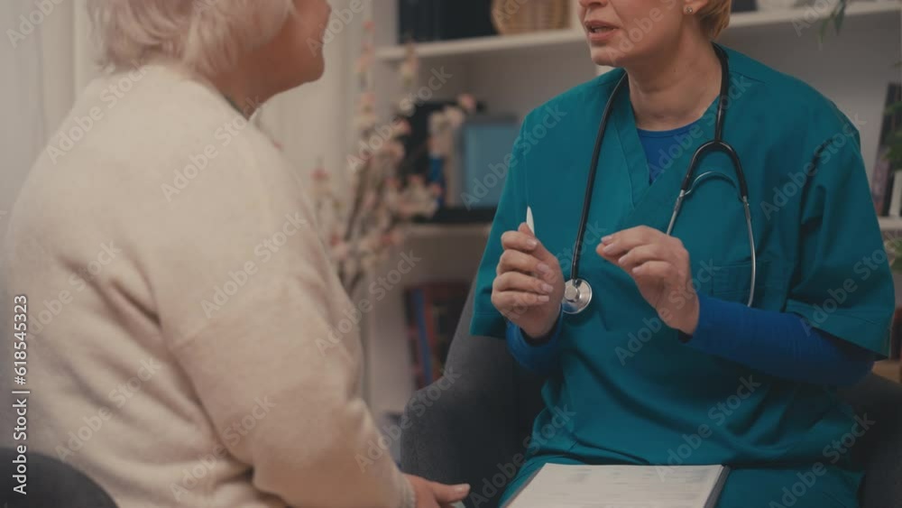 Doctor comforting senior patient at home, doctor's visit, medical services Doctor comforting senior patient at home, doctor's visit, medical services