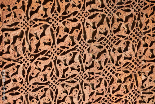 Wall decorative patterns of Qutb complex in South Delhi, India, close up ancient bas relief photo