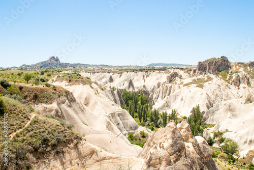 The canyon and old castle with blue sky at goreme cappadocia