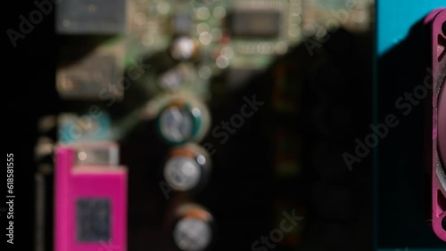 Old PC board with fan and processor. Dolly shot