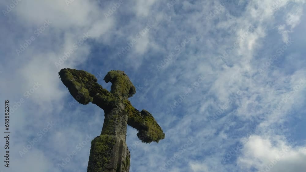 Ancient Stone Cross Against a Dramatic Cloudy Sky, Symbolizing Faith, History, and Spirituality Ancient Stone Cross Against a Dramatic Cloudy Sky, Symbolizing Faith, History, and Spirituality