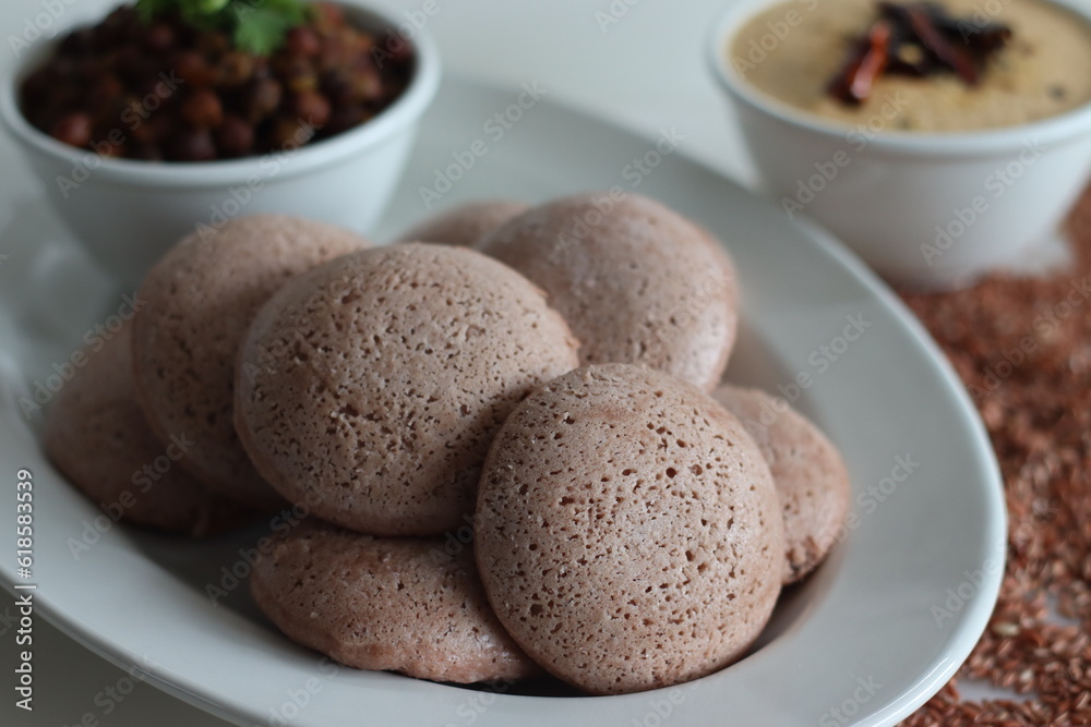 Navara rice idly served black chickpea curry. Steamed savoury rice cake made by a batter of fermented de husked black lentils and navara rice. Navara rice idly served black chickpea curry. Steamed savoury rice cake made by a batter of fermented de husked black lentils and navara rice.