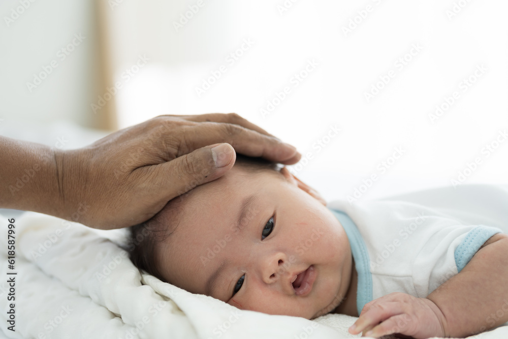 Newborn baby sleeping in prone position on bed. Newborn baby or infant