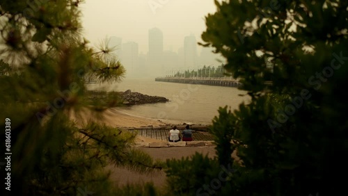 Friends Watching Smokey New York Skyline