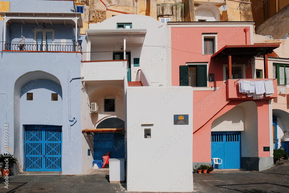 Colorful building architecture at Marina Corricella, Procida Island, fishing village at the Mediterranean sea, Bay of Naples, Italy