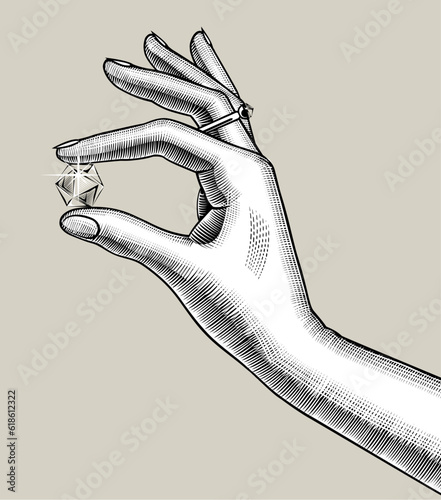 Woman's hand holding diamonds in her fingers. Vintage engraving stylized drawing. Vector illustration