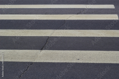 footpath white stripes gray asphalt Road traffic. © Electrovenik
