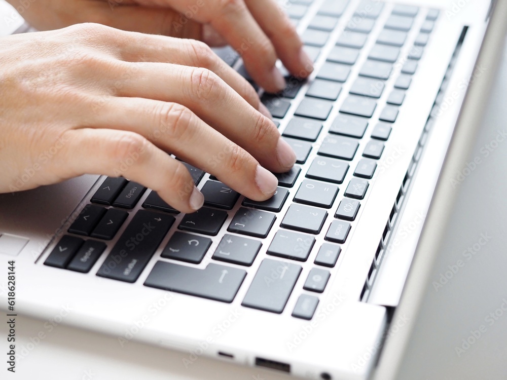 Close up of a woman typing on a keyboard Close up of a woman typing on a keyboard