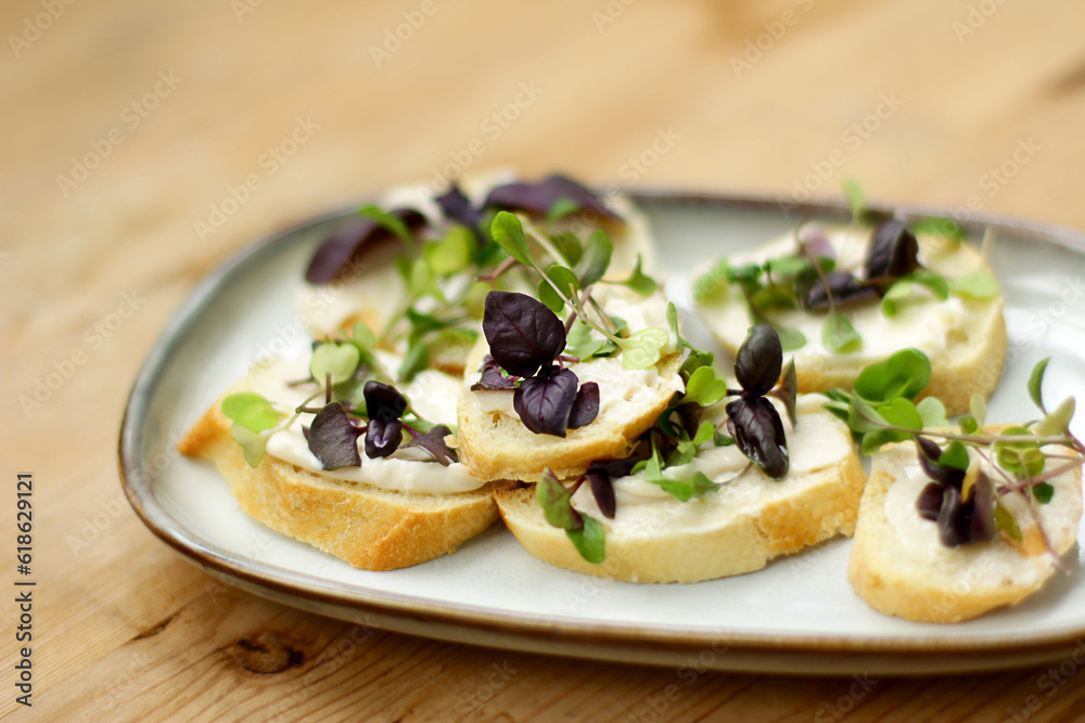 mini sandwiches with micro-greens, a light snack of bread, cheese and basil mini sandwiches with micro-greens, a light snack of bread, cheese and basil