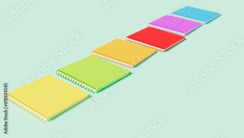 3d rendering of study notebooks of different colors on blue table, education and training theme