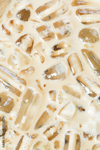 iced coffee and ice background,Close-up of Cold latte drink with ice cubes,