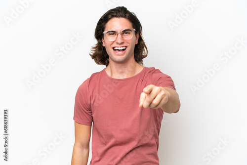 Young handsome man isolated on white background frustrated and pointing to the front
