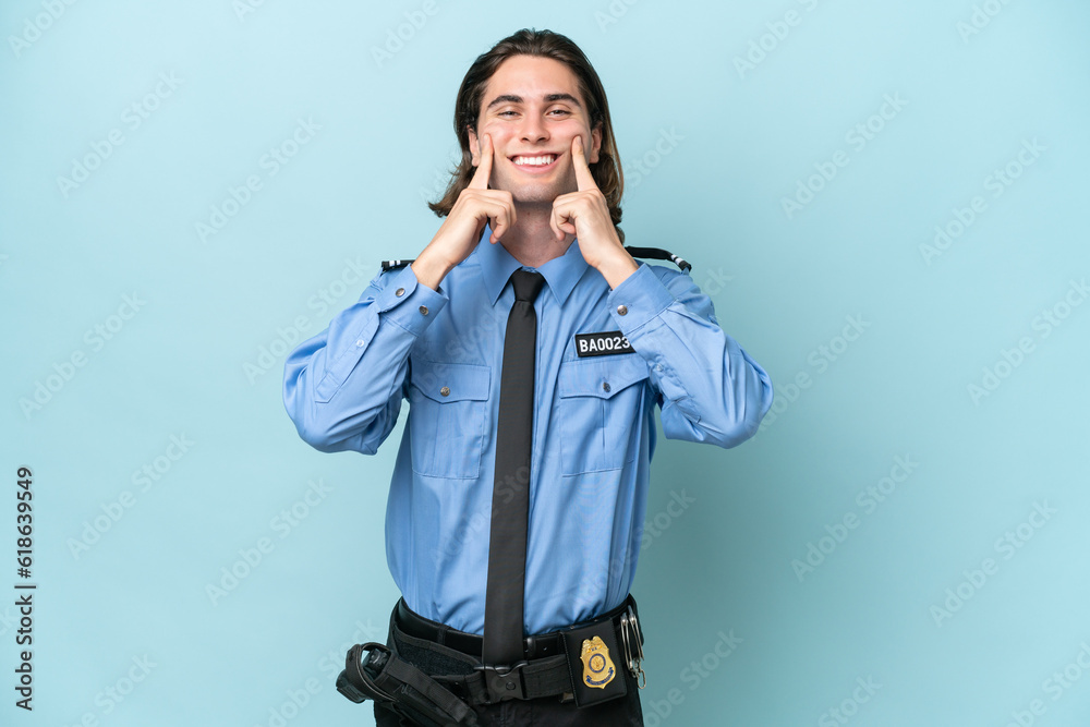 Young police caucasian man isolated on blue background smiling with a happy and pleasant expression Young police caucasian man isolated on blue background smiling with a happy and pleasant expression