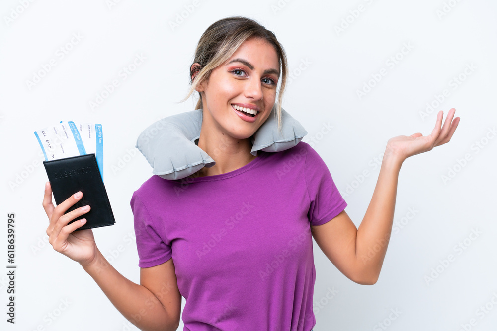 Young pretty Uruguayan woman with Inflatable Travel Pillow isolated on white background extending hands to the side for inviting to come Young pretty Uruguayan woman with Inflatable Travel Pillow isolated on white background extending hands to the side for inviting to come