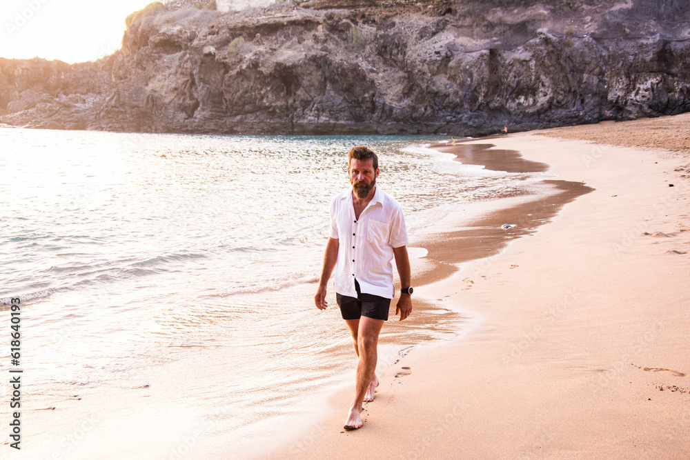 Man walking at beach alone