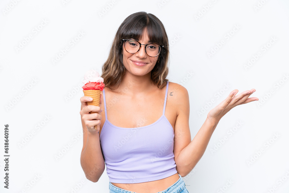 Young caucasian woman with a cornet ice cream over isolated white background with shocked facial expression Young caucasian woman with a cornet ice cream over isolated white background with shocked facial expression