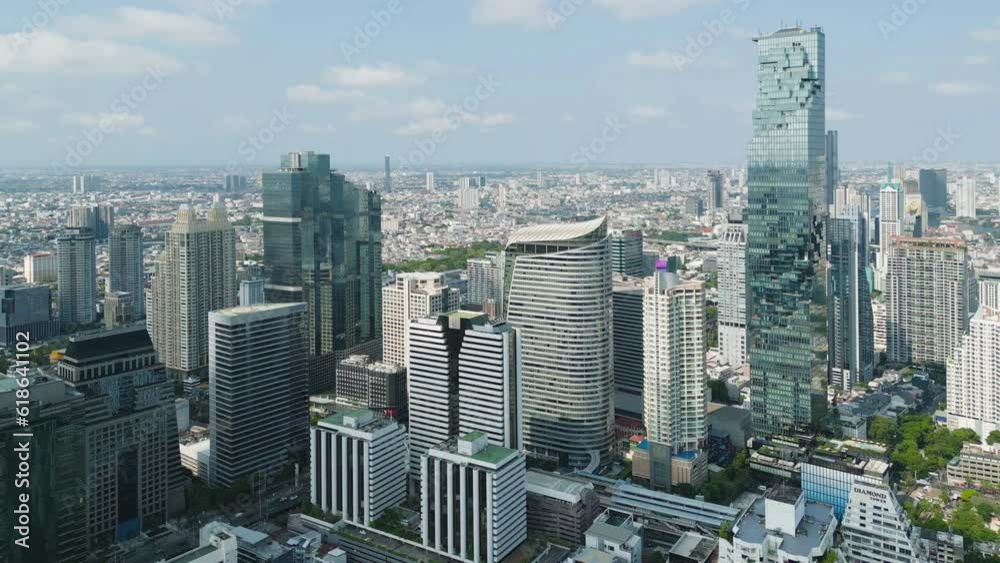 Aerial view of Bangkok Downtown Skyline, Thailand. Financial district and business centers in smart urban city in Asia. Skyscraper and high-rise buildings at sunset.