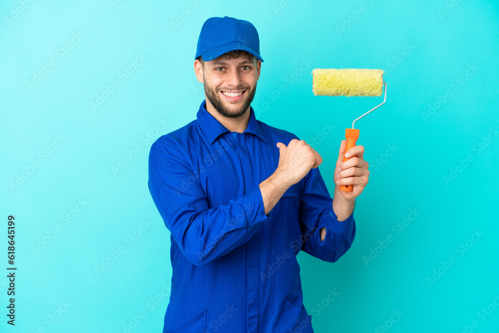 Painter caucasian man isolated on blue background proud and self-satisfied Painter caucasian man isolated on blue background proud and self-satisfied