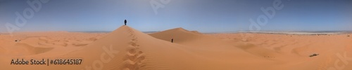 Hiking up the Great Dune of Merzouga in the Erg Chebbi desert, Moroccan Sahara