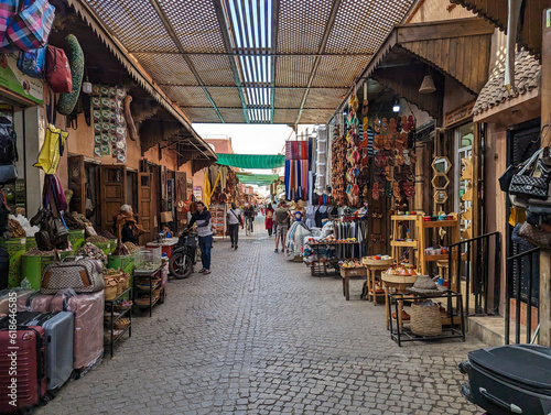 Impressions of typical Moroccan souks in the Marrakechs medina photo