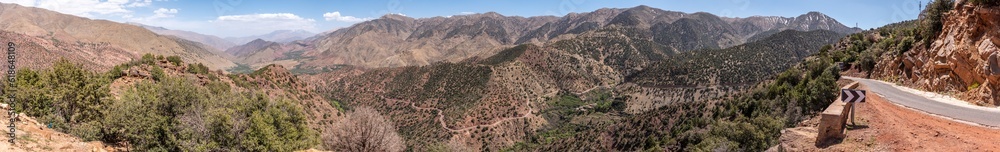 Scenic mountain landscape at northern Tizi n'Test pass in the Atlas mountains, the road meanders upwards Scenic mountain landscape at northern Tizi n'Test pass in the Atlas mountains, the road meanders upwards