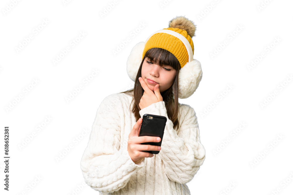 Little caucasian girl wearing winter muffs over isolated background thinking and sending a message Little caucasian girl wearing winter muffs over isolated background thinking and sending a message