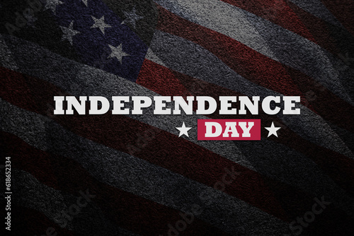 Inscription Independence Day on balck textured background with transparent American flag.