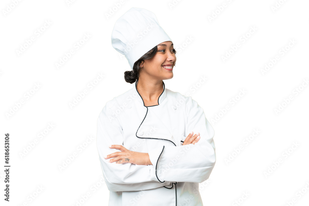 Young chef Argentinian woman over isolated background looking side