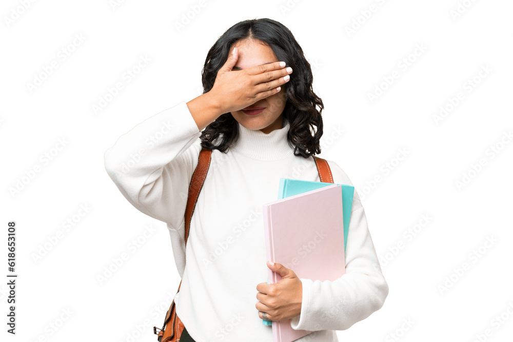 Young Argentinian student woman over isolated background covering eyes by hands. Do not want to see something