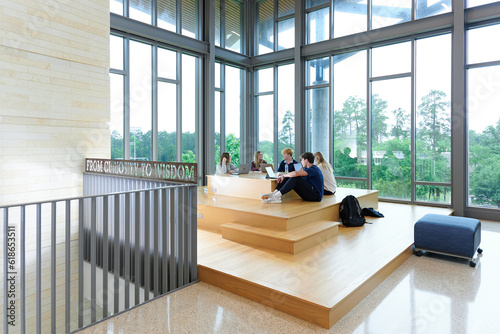 THE WOODLANDS, TEXAS - May 10th 2023: The John Cooper School’s headmaster is pictured with senior students inside the state of the art science building in The Woodlands, Texas.