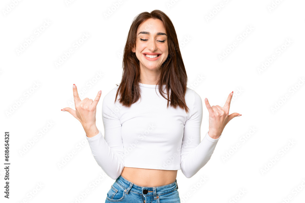 Young caucasian woman over isolated chroma key background making horn gesture Young caucasian woman over isolated chroma key background making horn gesture