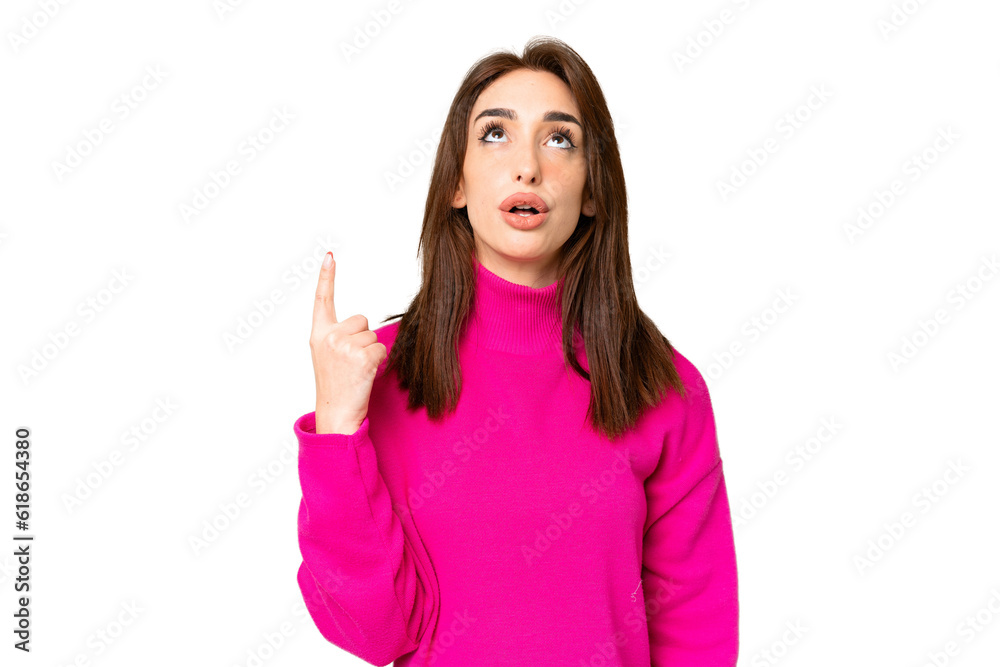 Young caucasian woman over isolated chroma key background pointing up and surprised Young caucasian woman over isolated chroma key background pointing up and surprised