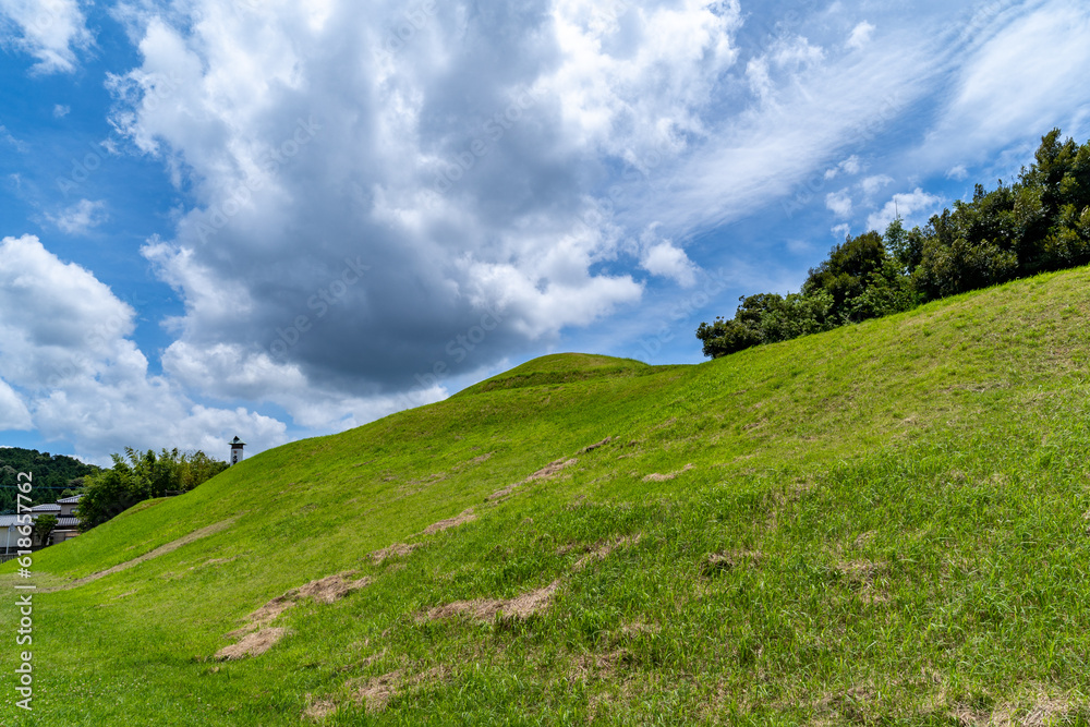 Hill - ancient tomb - and blue sky in Saga prefecture, Japan.
