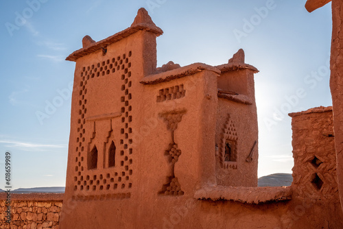 Scenic ornate detail of a small tower over the roofs of the historic Ait Ben Haddou village