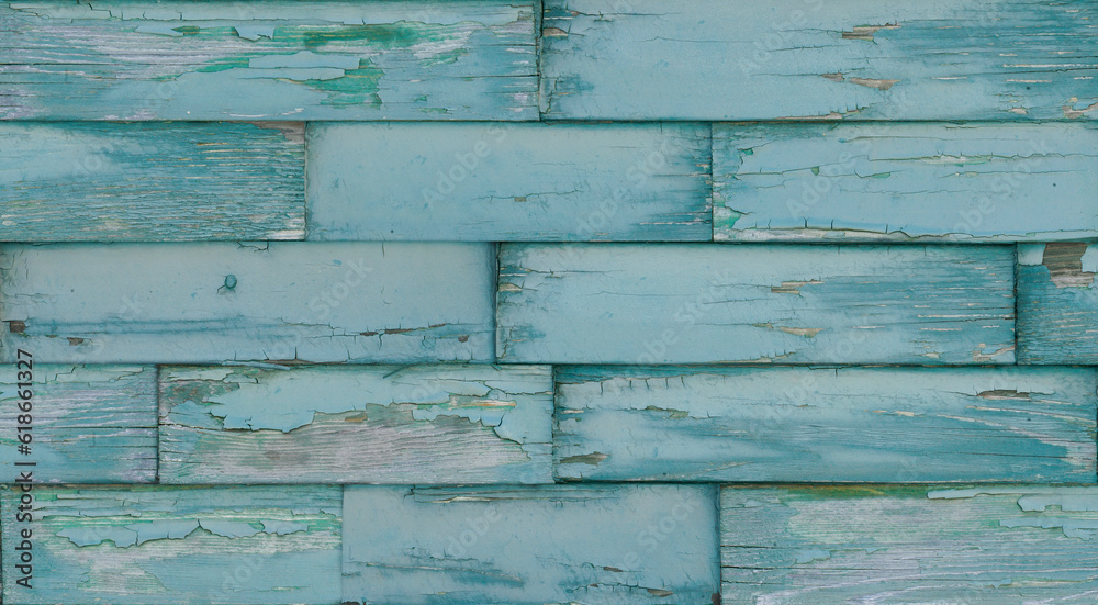 Obraz premium Crackled paint finish on blue green rustic wood planks. Aged reclaimed barn wood.