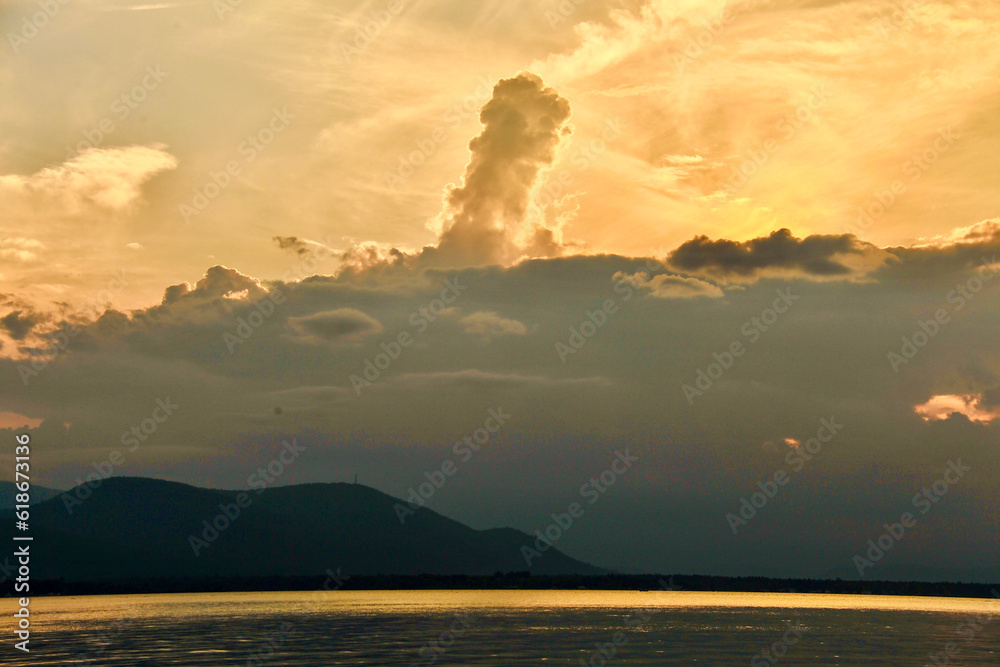 sunset in the mountains clouds in the sky 