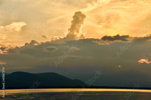 sunset in the mountains clouds in the sky 