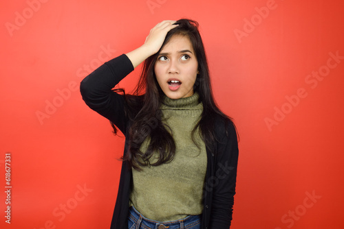 Forget Something Of Beautiful Asian Woman Isolated On Red Background © Sino Images Studio