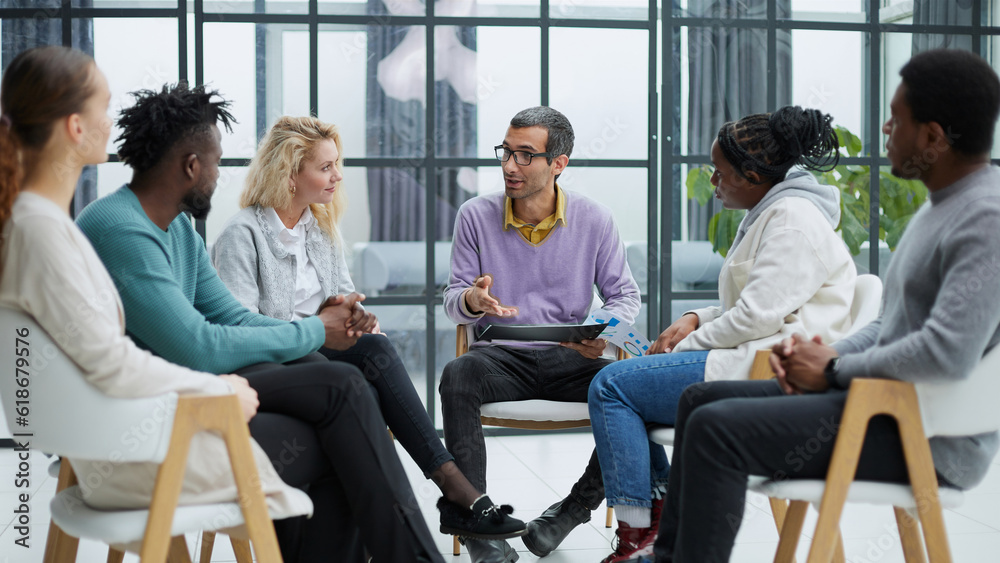 Group of multi-ethnic business people in a seminar Group of multi-ethnic business people in a seminar
