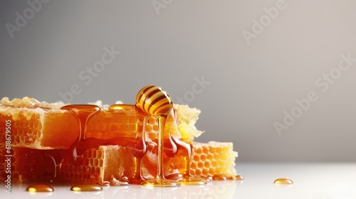Honeycomb with honey dipper isolated on a white background. Organic natural ingredients.